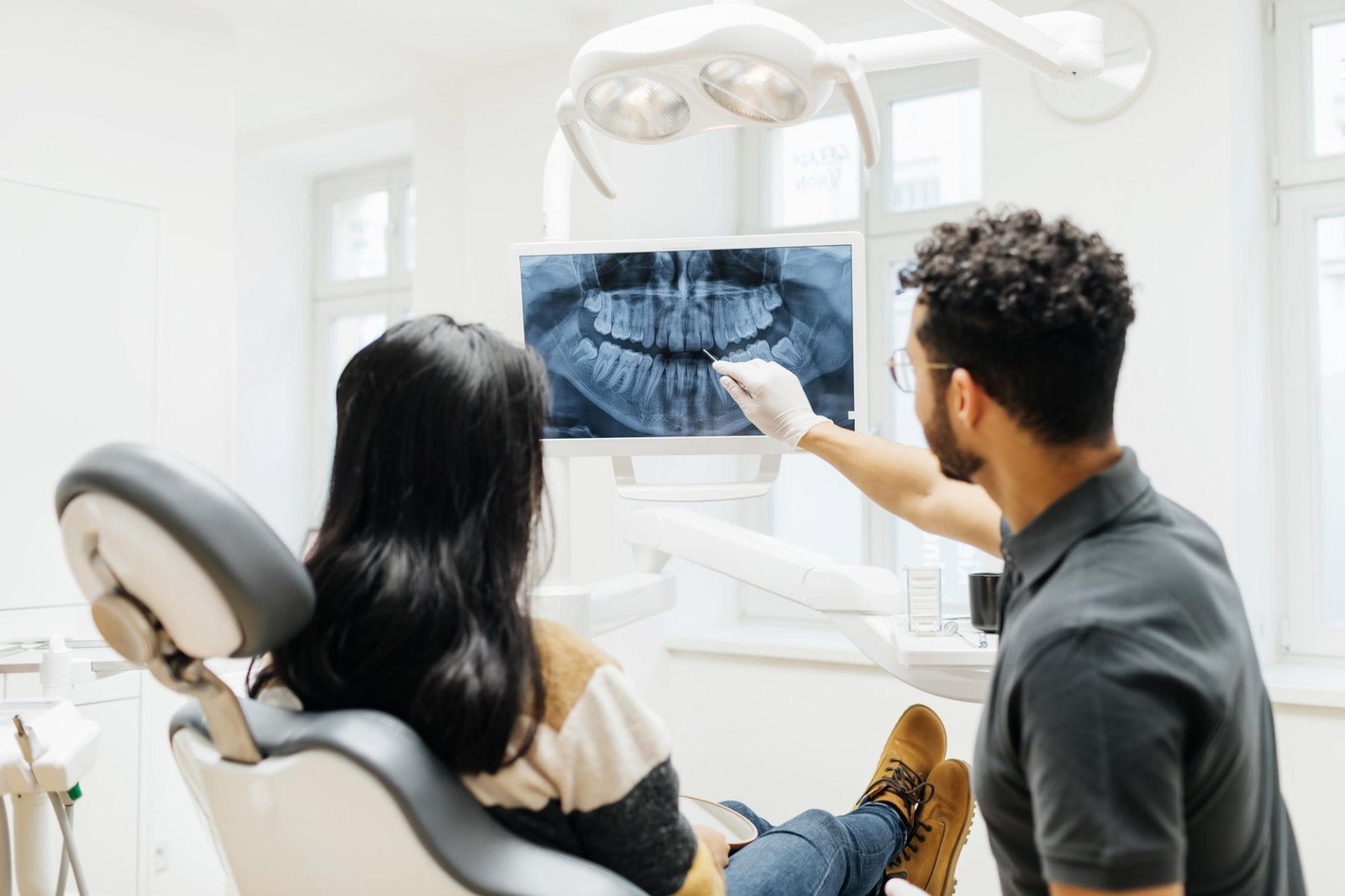 Dentist reviewing a digital 3D model of teeth for treatment planning